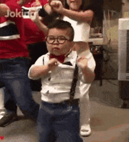 Little Boy In Glasses And Tie Dancing GIF
