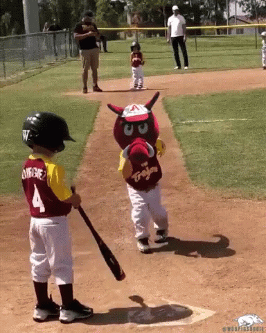 Little Boy in Jersey Number 4 Playing Baseball With Mascot