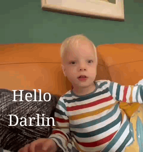 Little Boy in Striped Shirt Says Hello