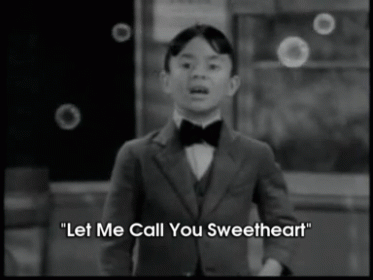 Little Boy in Suit and Bow Tie Says Let Me Call You Sweetheart