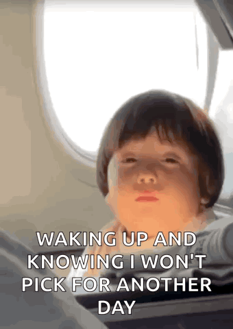 Little Boy Making Face by Airplane Window