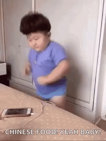 Little Boy On Bed With Plugged Cell Phone GIF