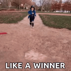 Little Boy Running Down Dirt Path Like a Winner