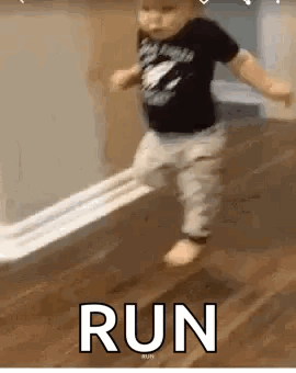 Little Boy Running on Wooden Floor