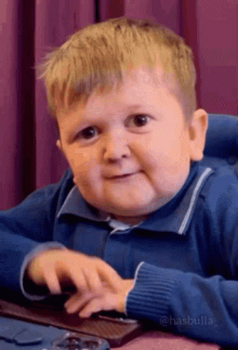Little Boy Using Computer Mouse Making Funny Face