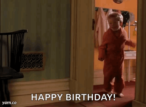 Little Boy Walking Through Doorway Saying Happy Birthday
