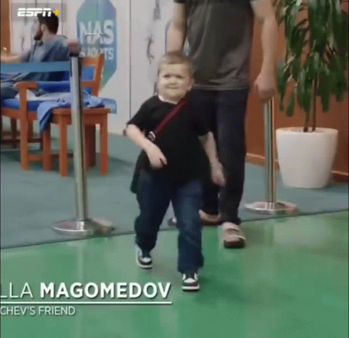 Little Boy Walking With Man La Magomedov