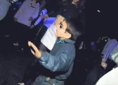 Little Boy Wearing Sunglasses Dancing in Dark Room