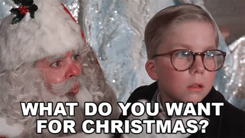 Little Boy With Glasses Talking to Santa Claus Saying What Do You Want For Christmas
