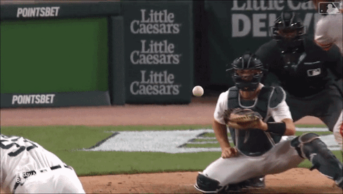Little Caesars Sign Behind Catcher