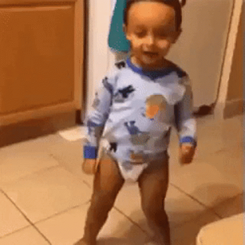 Little Crowned Girl Beside Man With Wooden Spoon GIF