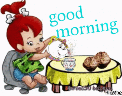 Little Girl at Table With Cupcakes Saying Good Morning