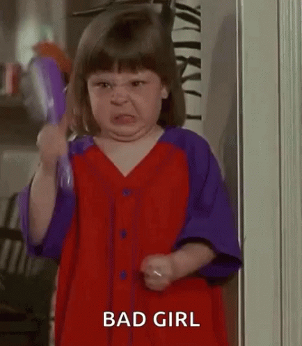 Little Girl Brushing Hair Making Face