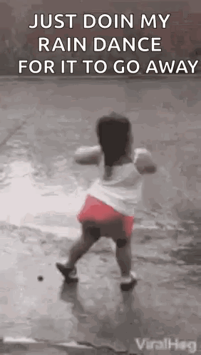 Little Girl Dancing in Rain