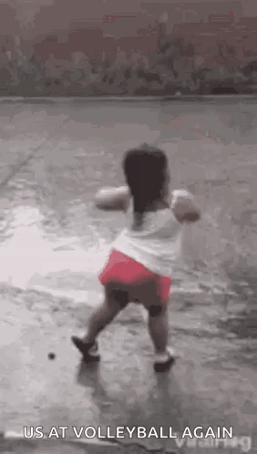 Little Girl Dancing in Rain Playing Volleyball