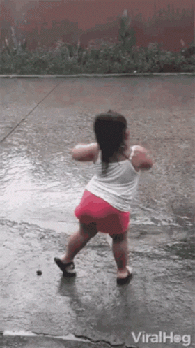 Little Girl Dancing In The Rain GIF
