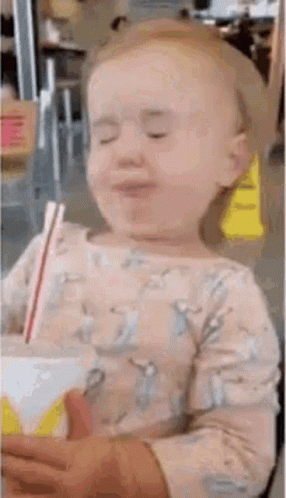 Little Girl Drinking Through Straw