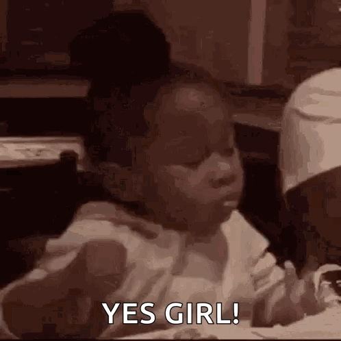 Little Girl Eating with Spoon