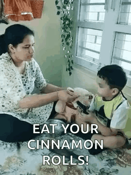 Little Girl Feeding Boy Pizza Slice