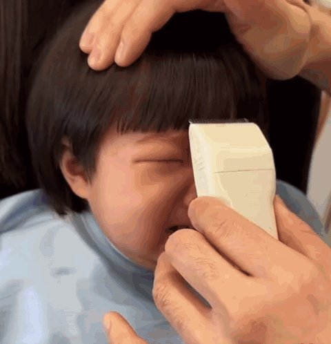 Little Girl Getting Hair Cut By Man GIF