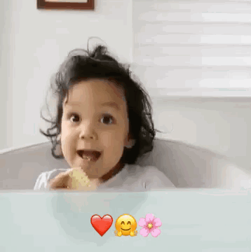Little Girl Giving Thumbs Up in Bathtub