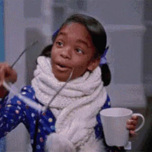 Little Girl Holding Coffee Cup And Spoon GIF