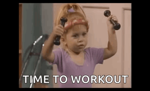 Little Girl Holding Dumbbells