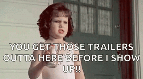 Little Girl Holding Milk Making Funny Face At Door GIF