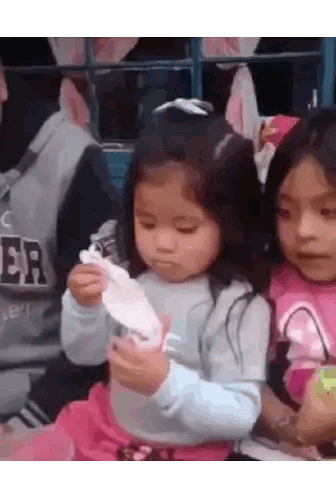 Little Girl Holding Paper