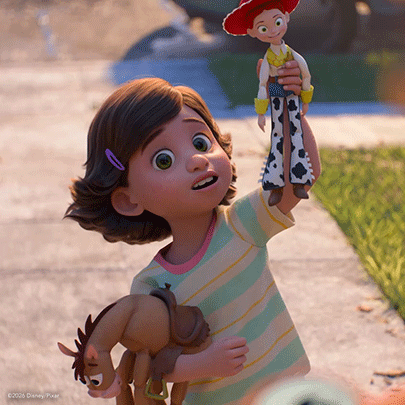 Little Girl Holding Toy Saying Jessie