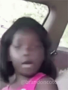 Little Girl in Back Seat Eyes Closed Mouth Open
