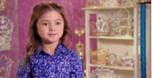 Little Girl in Blue Shirt by Trophy Shelf