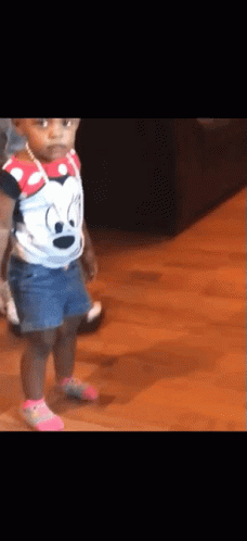 Little Girl in Minnie Mouse Shirt and Denim Shorts