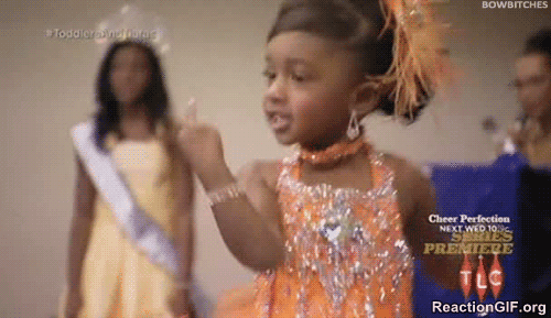 Little Girl in Pageant Dress Giving Middle Finger