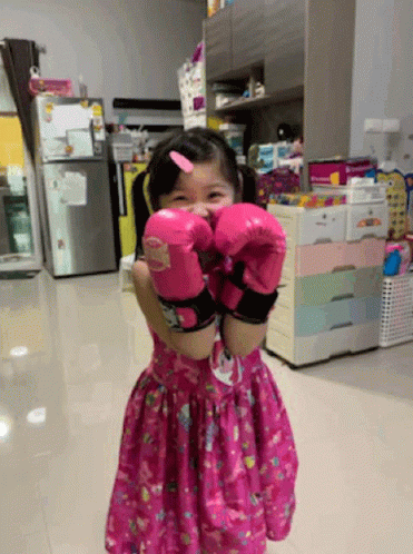 Little Girl in Pink Boxing Gloves