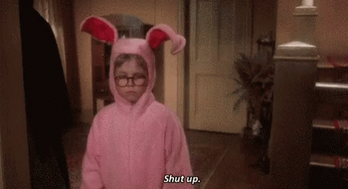 Little Girl in Pink Bunny Costume and Glasses Saying Shut Up