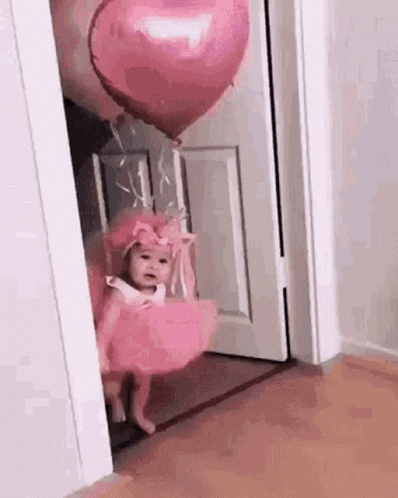 Little Girl in Pink Dress Holding Pink Heart Balloon