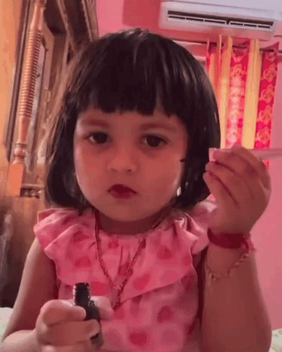 Little Girl in Pink Dress With Lipstick