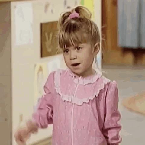 Little Girl in Pink Dress With Mouth Open