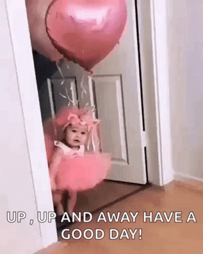Little Girl in Pink Dress With Pink Balloon in Doorway