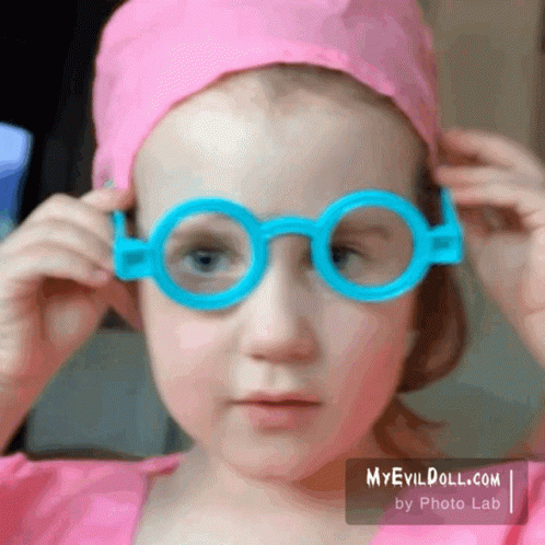 Little Girl in Pink Hat and Blue Glasses myevildoll.com