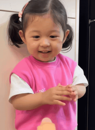 Little Girl in Pink Shirt Saying Just Dot