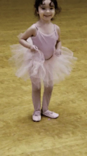 Little Girl in Pink Tutu and White Shoes