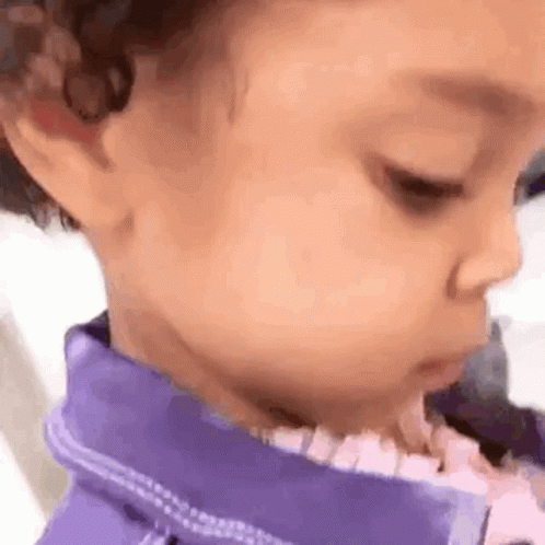 Little Girl in Purple Jacket