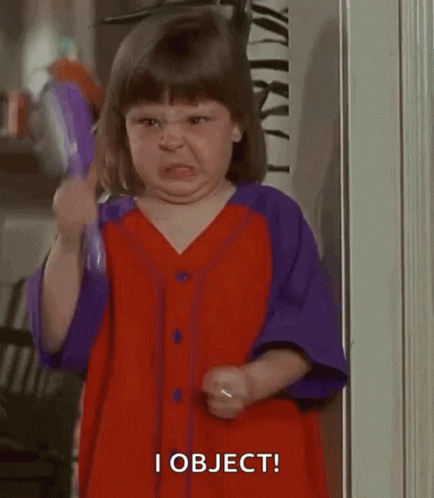 Little Girl in Red and Purple Dress Holding Brush Angry