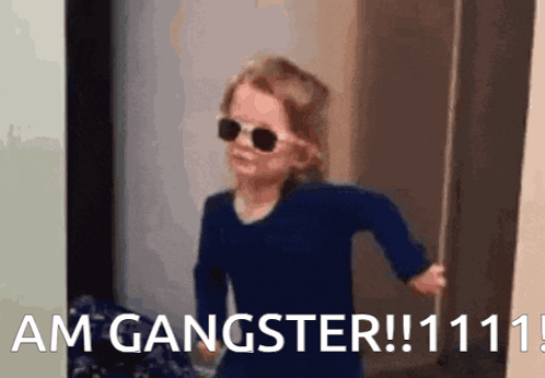 Little Girl In Sunglasses Saying Am Gangster GIF