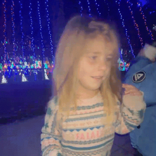 Little Girl in Sweater Saying I Am