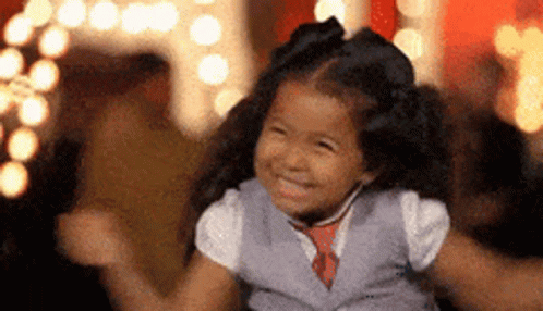 Little Girl in Vest and Tie Dancing