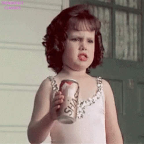 Little Girl in White Dress Holding Soda