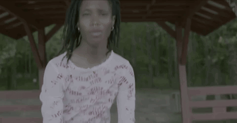 Little Girl In White Shirt Dancing In Front Of Gazebo GIF